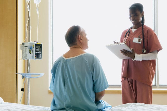 Nurse monitoring patient