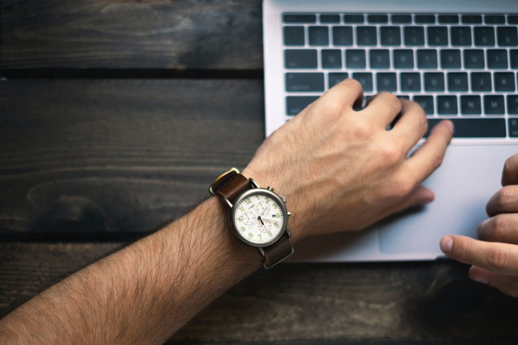 time management accounting jobsperson wearing brown and white watch